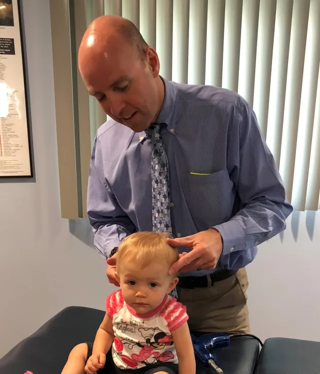 Dr. Eric Christie caring for a young patient