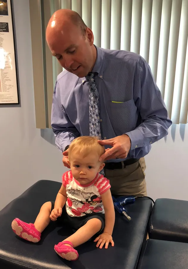 Dr. Eric Christie caring for a young patient